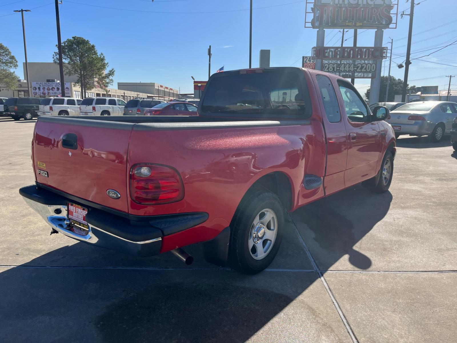 2003 red /TAN Ford F-150 XL SuperCab Flareside 2WD (1FTRX07213K) with an 4.2L V6 OHV 12V engine, Automatic transmission, located at 14700 Tomball Parkway 249, Houston, TX, 77086, (281) 444-2200, 29.928619, -95.504074 - Photo #6